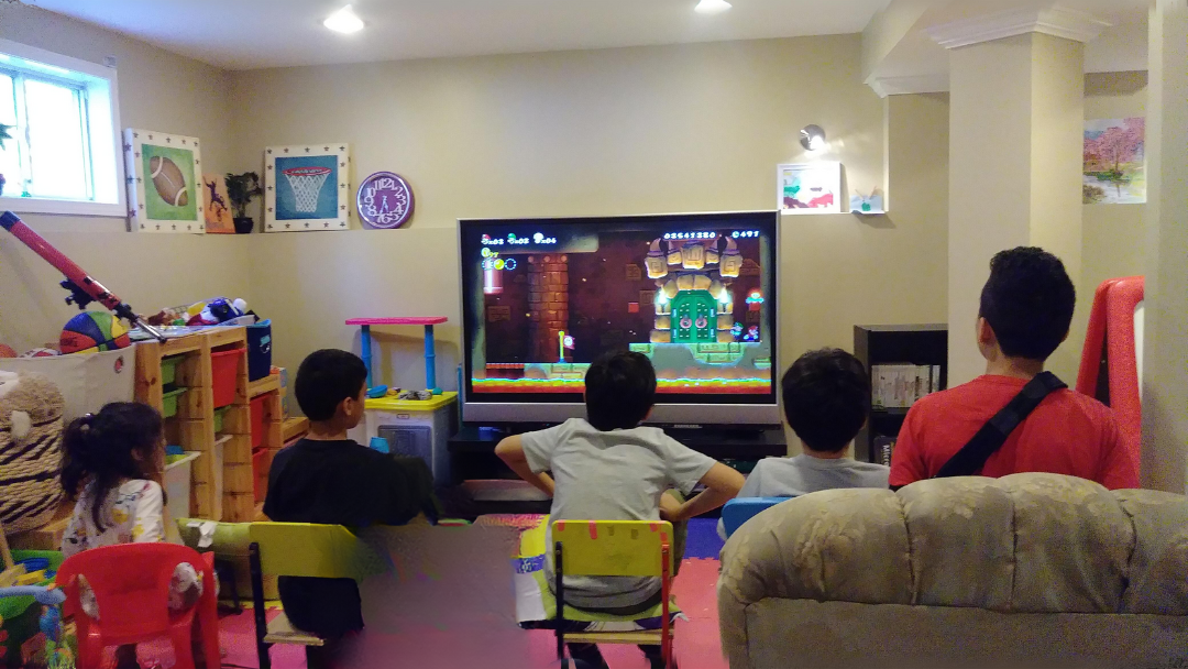 Kids playing Mario Brothers 